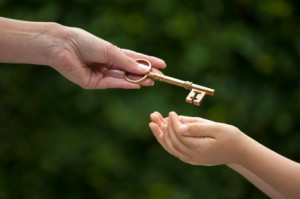 adult hands key to child