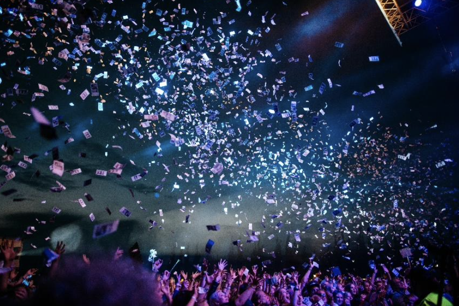 confetti falling from the ceiling at a concert